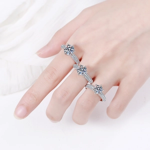 S925 sterling silver moissanite rings set with round cut stones on white fabric