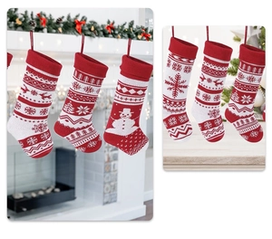 Detail of red and white knitted Christmas stockings with snowflake and reindeer patterns