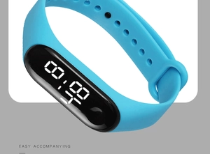 Close-up of sky blue waterproof sports watch with black LED screen and silicone strap