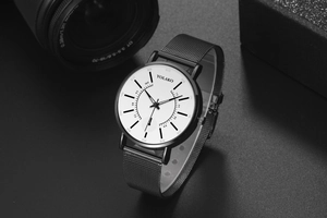 Detail view of Yolako quartz watch with white dial and black Milanese mesh strap