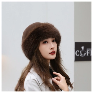 Detailed close-up of dark brown faux fur texture on a warm Russian style winter hat