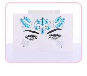 Close-up of blue and silver crystal face jewels set for party and stage makeup