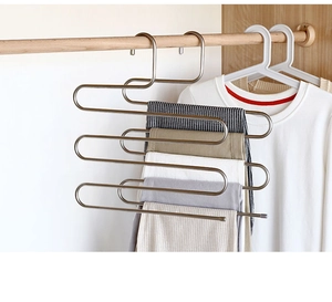 Detailed S-type multi-layer stainless steel trouser rack showing space-saving storage in closet