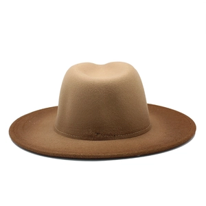 Detail of wide brim wool fedora hat featuring a two-tone gradient brown color design