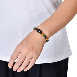 Zodiac bead bracelet with tiger eye stones and graphic beads on a model's wrist