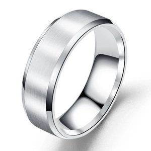 Macro shot of silver brushed stainless steel ring with polished beveled edges and matte finish