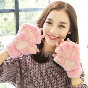 Close-up of pink plush cat paw fingerless gloves with soft 3D paw pads for winter