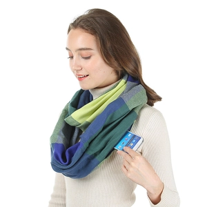 Detail shot of a blue and yellow plaid fleece neck warmer with a built-in phone pocket