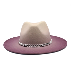 Detail of gradient wool felt fedora featuring a silver metal chain trim and wide brim