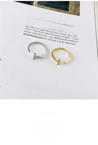 Close-up of gold and silver S925 sterling silver rings with micro-paved cubic zirconia