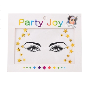 Detailed view of gold star-shaped face jewels with crystal accents in Party Joy packaging