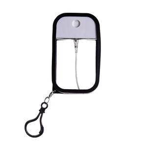 Detail of 50ml portable spray bottle with black frame, transparent body and clip