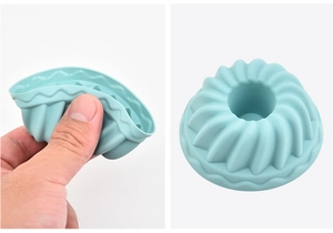 Close-up of flexible light blue silicone muffin mold showing high elasticity and soft texture