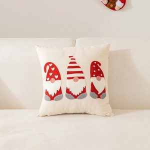 Christmas cushion cover with gnome embroidery on beige linen for festive sofa decor