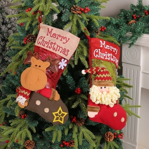 3D Santa and reindeer Christmas stockings hanging on a festive decorated pine tree
