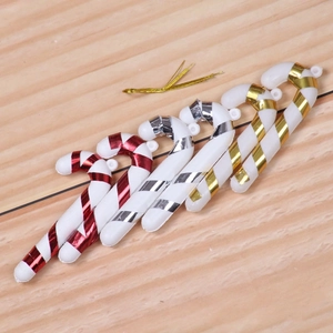 Set of 6 colorful Christmas candy cane ornaments with metallic stripes and gold ties