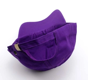 Detail of adjustable back strap and stitching on purple baseball cap for men