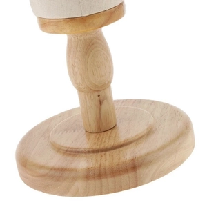 Detailed close-up of the round wooden base and support stand for mannequin heads