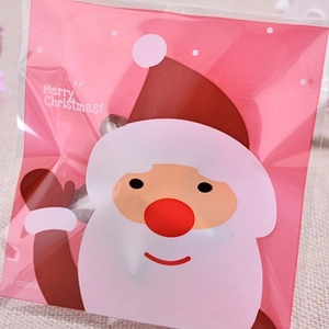 Pink Christmas self-sealing plastic candy bag featuring a cartoon Santa Claus and Merry Christmas text