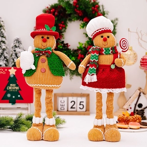 Detail of Christmas gingerbread man plush dolls with adjustable long legs for home decor