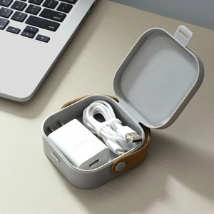 Portable light grey tech organizer box with brown leather handle for chargers and cables