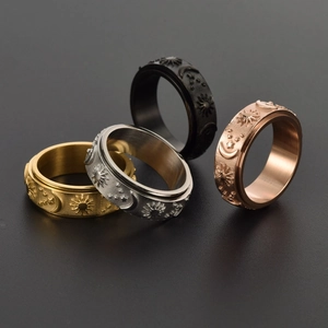 Rotating stainless steel rings with sun moon star patterns in gold silver black and rose gold