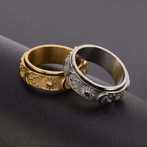 Rotating stainless steel rings with sun moon and star motifs in gold and silver finish