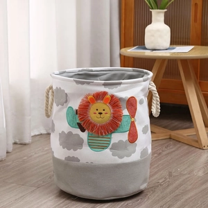 Detailed embroidery of lion pilot and airplane on a canvas storage basket for kids