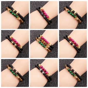 Detail shots of beaded bracelets with tiger eye, onyx, and zircon crown charms