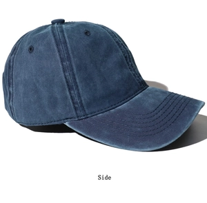 Side view of dark blue washed vintage baseball cap with cotton canvas stitch detail