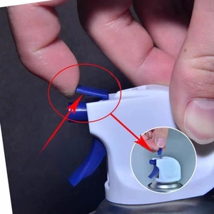 Macro detail of toilet anti-splash mousse nozzle with blue protective clip removal guide