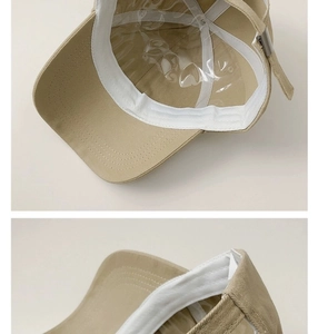 Detail view of khaki cotton canvas baseball cap featuring metal adjustable buckle and inner lining