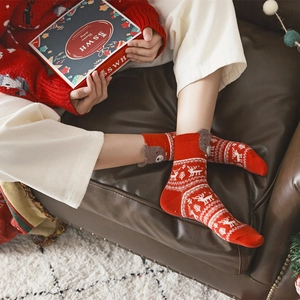 Red Christmas cotton socks with reindeer patterns and 3D bear decor in festive gift box