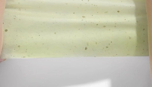 Close-up of translucent linen face blotting paper with visible natural wood pulp fibers
