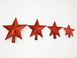 Detail of red glitter star Christmas tree toppers in various sizes with base poles