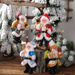 Set of four unique resin Santa Claus figurines with festive gift boxes and pinecones
