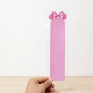 Detailed pink hair accessories display card with polka dot bow and hanging slots