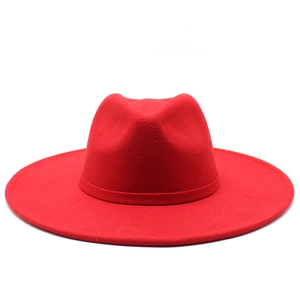 Detailed view of the red wool felt fedora featuring a wide brim and classic teardrop crown