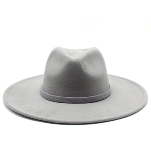 Detailed macro view of gray wool felt fedora texture and decorative ribbon band