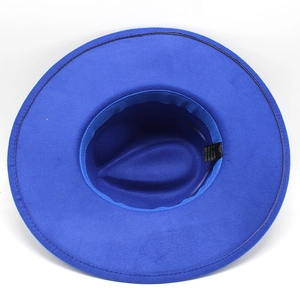 Detail view of the royal blue fedora hat interior showing fabric label and stitching