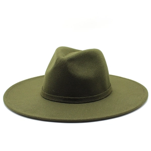 Detailed close-up of an olive green wool felt fedora hat featuring a stylish wide brim design