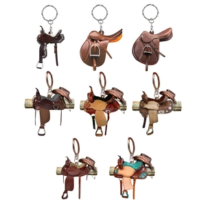 Un ensemble de divers porte-clés de selle de cowboy western avec effets 3D