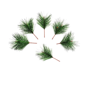 Detail showing six artificial dark green pine needles with plastic leaves on wire stems