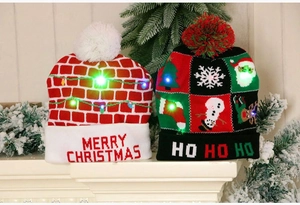 Detail of knitted Christmas hats with LED lights, Merry Christmas and Ho Ho Ho text