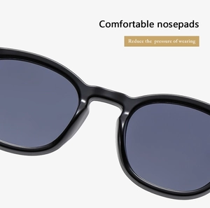 Macro view of integrated comfortable nosepads on oval sunglasses frame for pressure relief