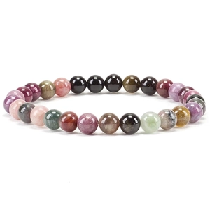 Macro detail of 6mm natural crystal beaded bracelet with multi-color gemstone beads
