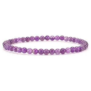 Macro shot of 4mm natural amethyst beaded bracelet with polished round purple stones