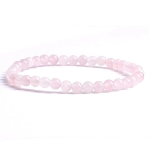 Close-up of 4mm natural rose quartz beaded bracelet with translucent pink stones