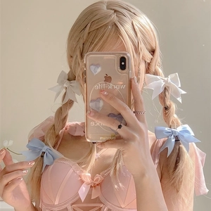 Chic pink bow hair clip styled on golden hair in a casual mirror selfie for girls