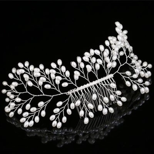 Detailed view of handmade bridal hair vine with pearls and silver woven wire branches